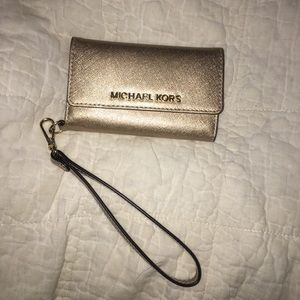 Michael Kors gold wristlet